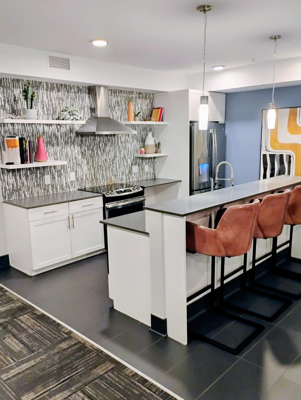 Kitchen remodel with island, backsplash, and white cabinetry
